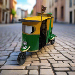 Hand-painted metal auto rickshaw pen stand with functional round holder, ideal for office desk decoration and gifting.