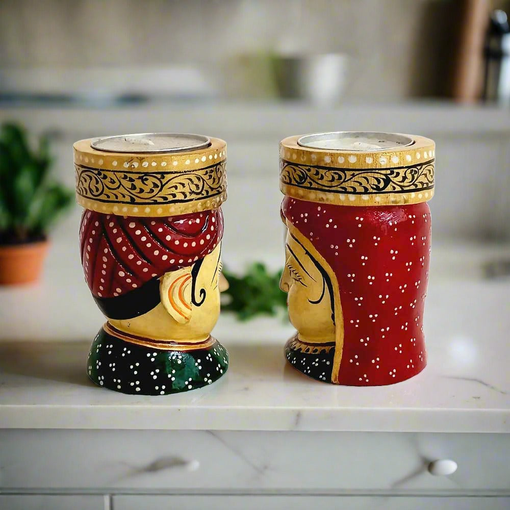 Wooden tea light candle holder with intricate hand-painted traditional design of Kaka and Kaki faces.