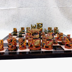 Handpainted wooden chess set showcasing Ambabari style, combining regal colors and majestic craftsmanship.
