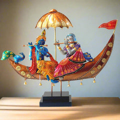 An impressive and beautifully crafted Radha Krishna showpiece on a wooden platform, perfect for table decor.