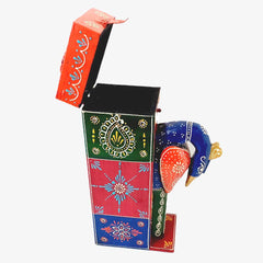 A handcrafted Indian handicraft peacock wine bottle holder with beautiful hand painting.