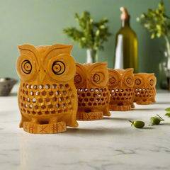 Kadam wood owl figurine set featuring fine mesh carvings and black eyes, suitable for decorative display.
