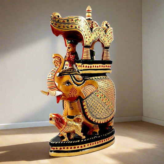 Attractive hand-painted Ambabari elephant statue made from high-quality kadamb wood, adding a royal touch to home or office.