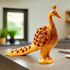 A Kadamb wood peacock statue that is a great option for decoration and gifting.
