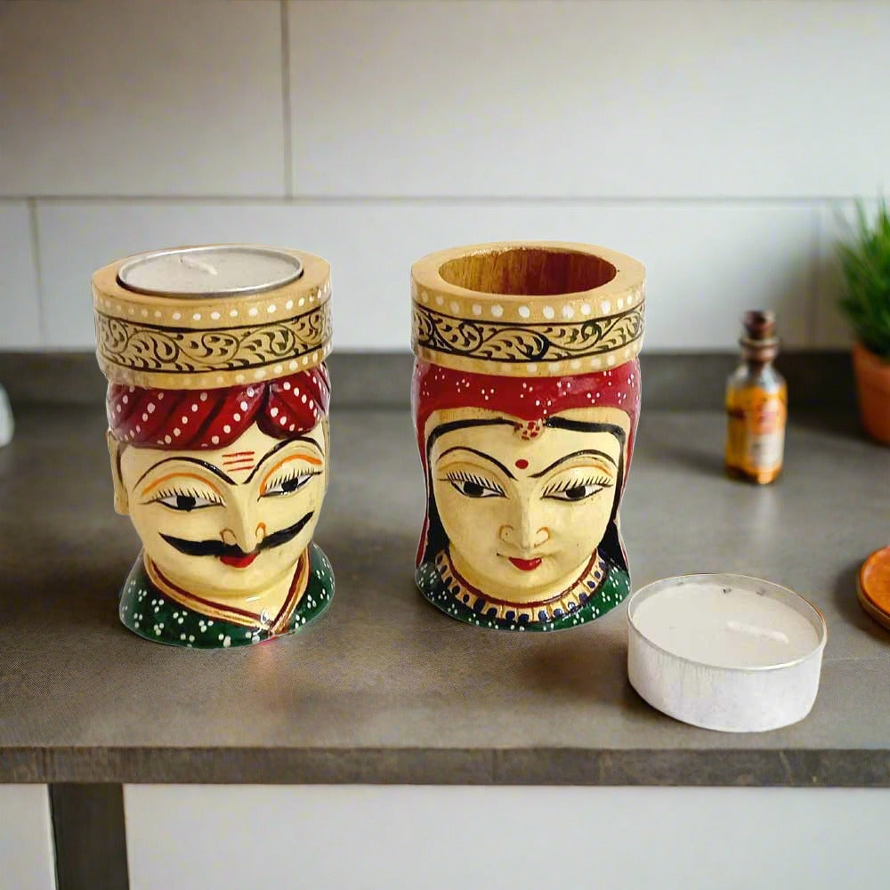 Artistic wooden candle stand representing Kaka and Kaki, with man wearing pagdi and woman in odhani, smokeless candle included.