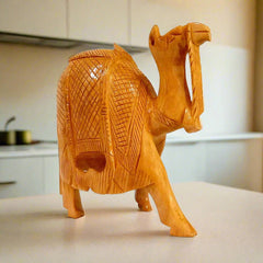 Lifestyle display of carving camel kathidar wooden statue enhancing showcase beauty