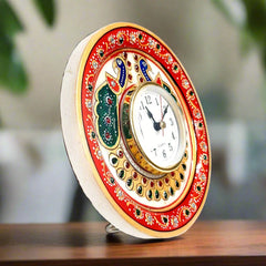 Sparkling red green white kundan stones detail on Indian marble table clock.