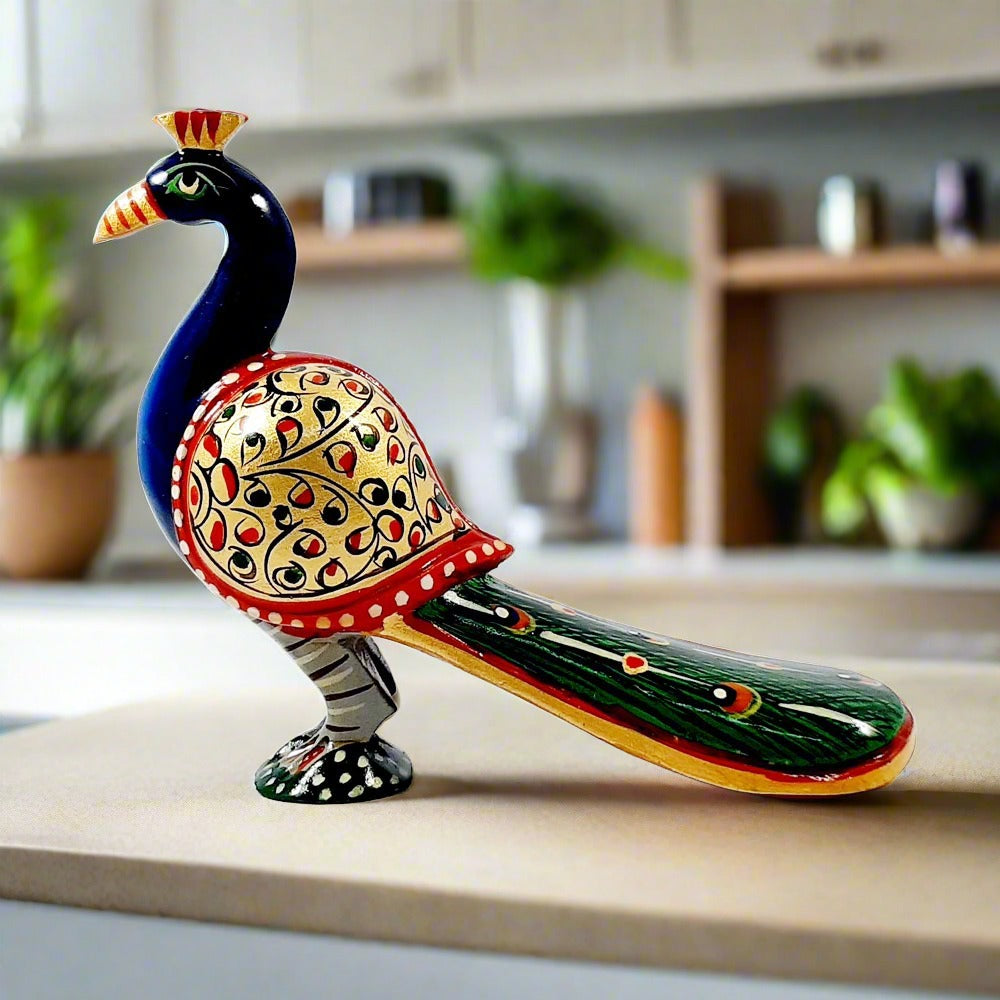 A long-tailed wooden peacock statue with very nice hand painting in vibrant colors.