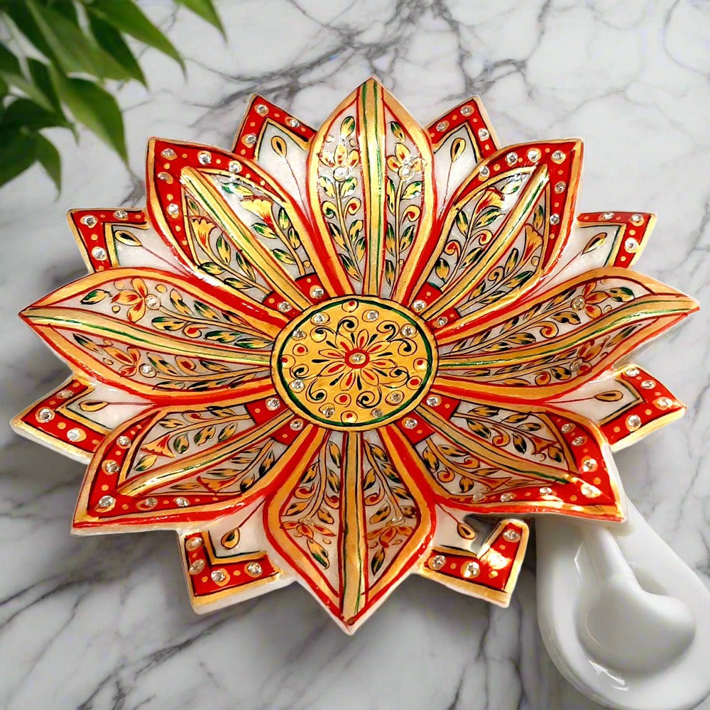 Lotus design marble urli decorated with hand painting, suitable for home and office pooja room decor.