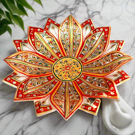 Lotus design marble urli decorated with hand painting, suitable for home and office pooja room decor.