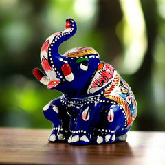 A lucky elephant showpiece, a seated metal figurine perfect for home decoration or gifting.