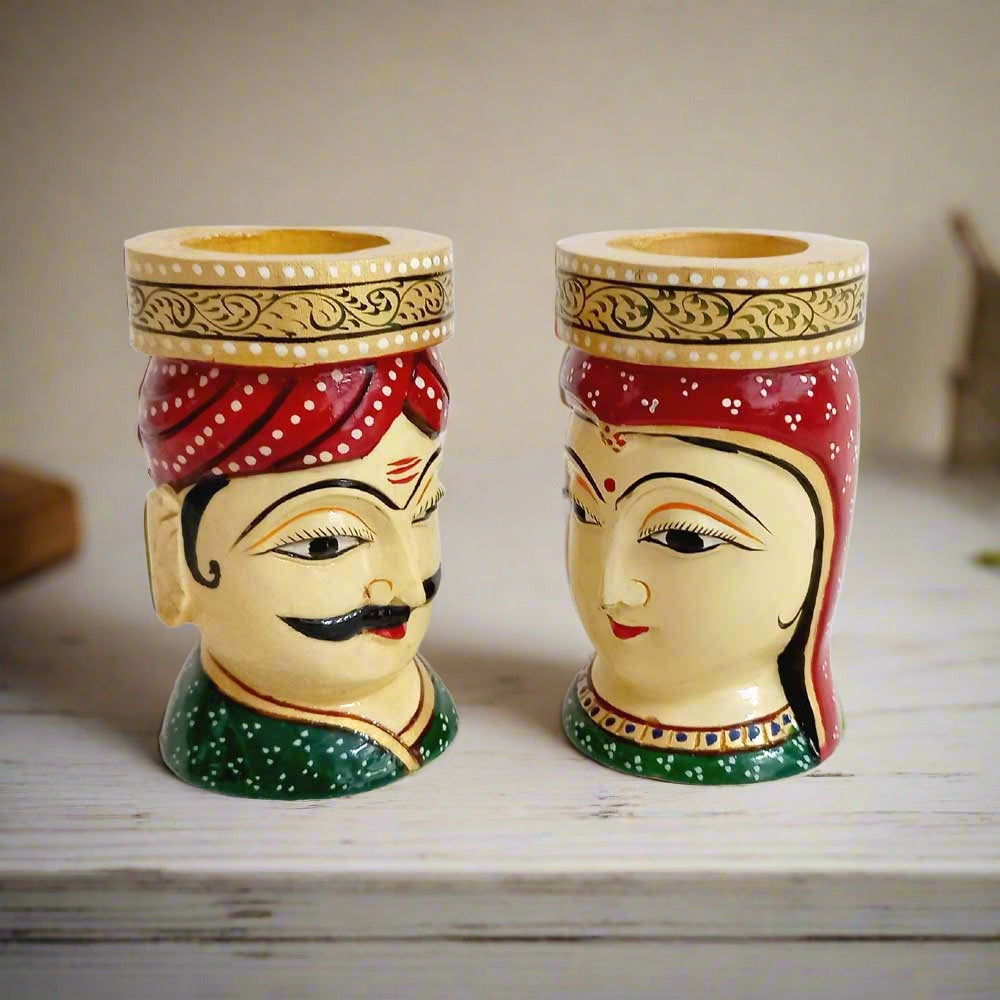 A luxurious and decorative wooden man and woman pen stand, a great option for a memorable gift.