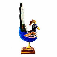 A magnificent hand-painted wooden peacock that attracts everyone with its stunning appearance.