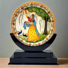 A magnificent hand-crafted lady painting on a round marble plate with beautiful emboss work on the border.