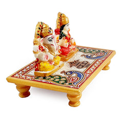 A marble God and Goddess idol on a decorated chowki, ideal for a pooja room, office, or home.