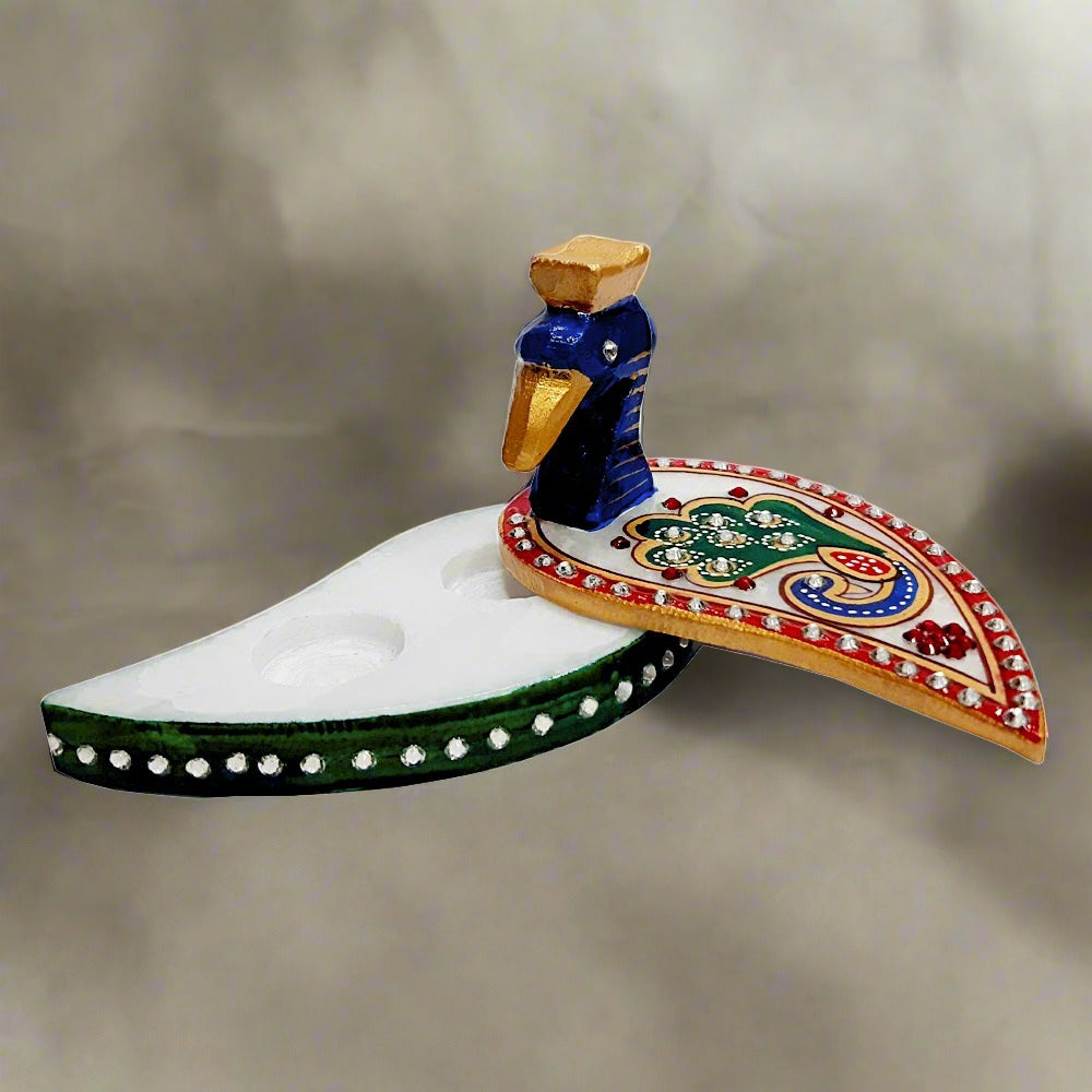 A marble kumkum chopra decorated with kundan, a perfect return gift for pooja or wedding ceremonies and festival.