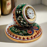 Elegant round marble table clock adorned with hand-painted peacock design and shimmering stones