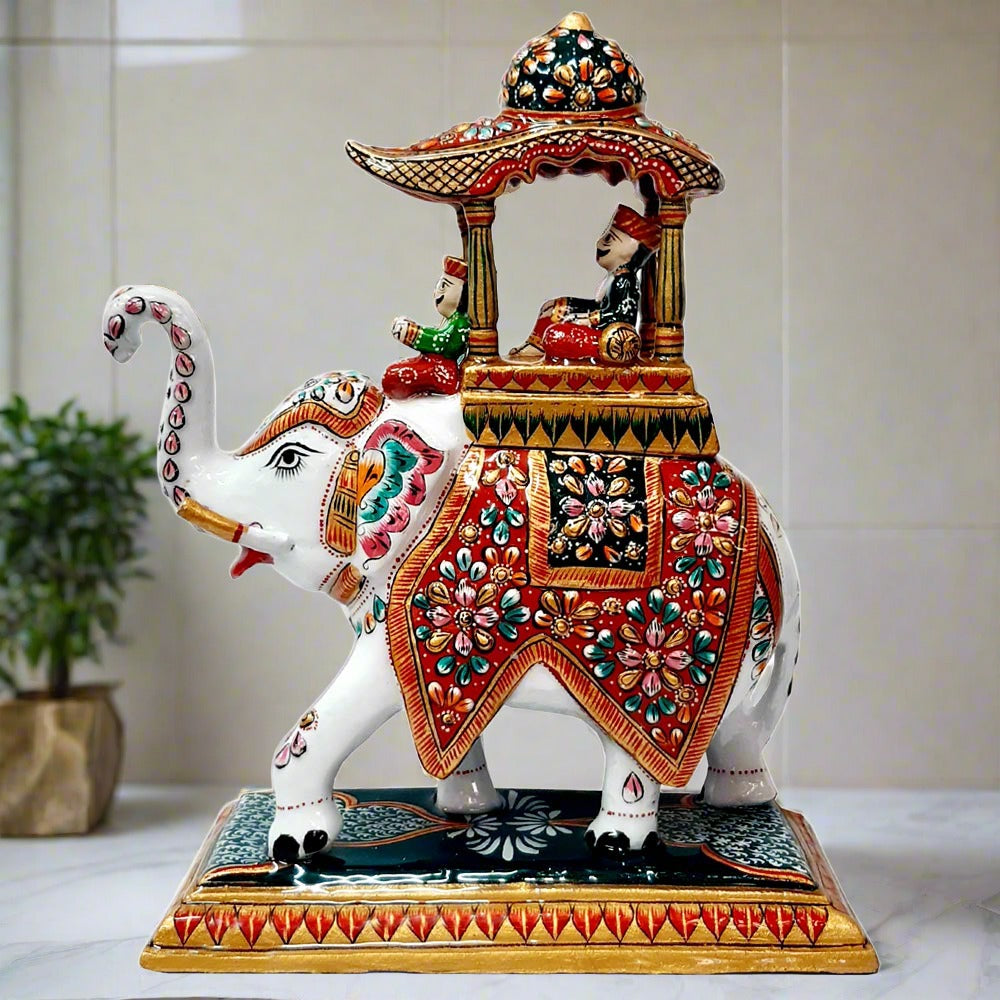 Stunning metal Ambabari elephant with intricate white meenakari painting, ideal for decorating living rooms and offices.