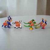 A set of 8 Meenakari metal toys, including elephants, cows, parrots, and peacocks, for Laddu Gopal.