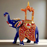 Metal Ambabari elephant statue painted with vibrant blue enamel and decorated with meenakari hand painting.