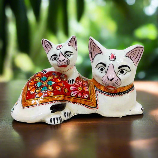 Beautiful metal baby cat showpiece adorned with vibrant enamel painting, perfect for home decor.