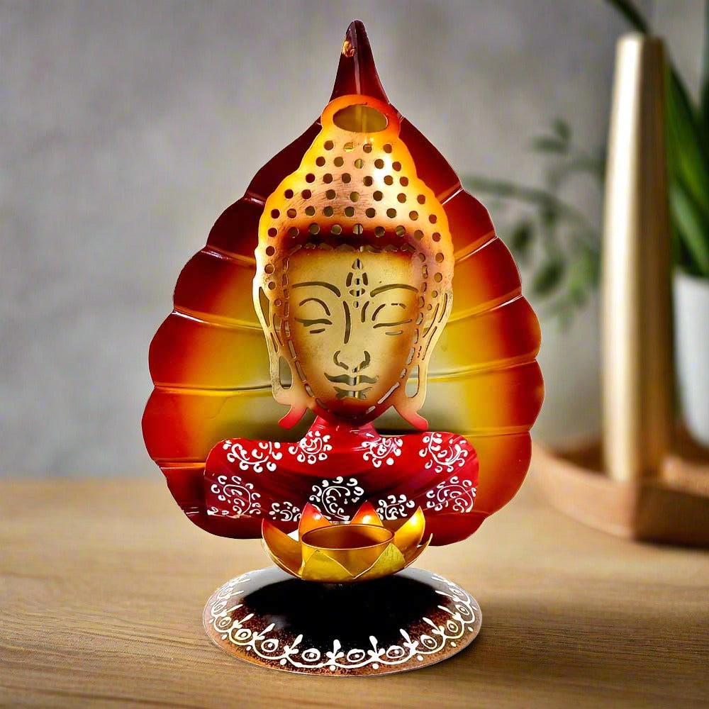 A beautiful metal Buddha tealight candle holder with a lotus flower candle stand.