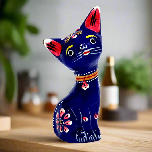 Metal cat statue with blue meenakari painting and embossed design, perfect for home decor and gifting