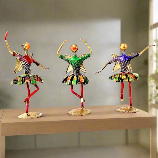 A hand-painted metal dancing dolls set of 3, perfect for home decor.