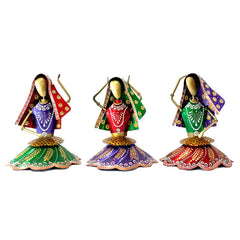 A showpiece of 3 women doing a folk dance of Rajasthan, made of hand-painted metal.