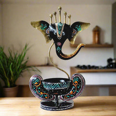 A beautiful hand-painted metal Ganesh tealight candle holder with a luxurious look.