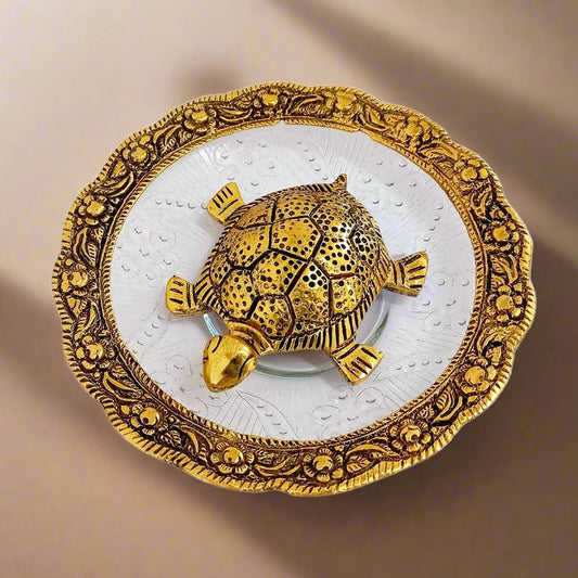 Vastu tortoise made of metal and glass with round glass bowl and intricate metal carving on border