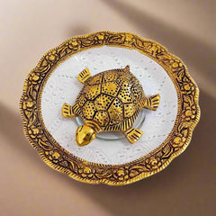 Vastu tortoise made of metal and glass with round glass bowl and intricate metal carving on border