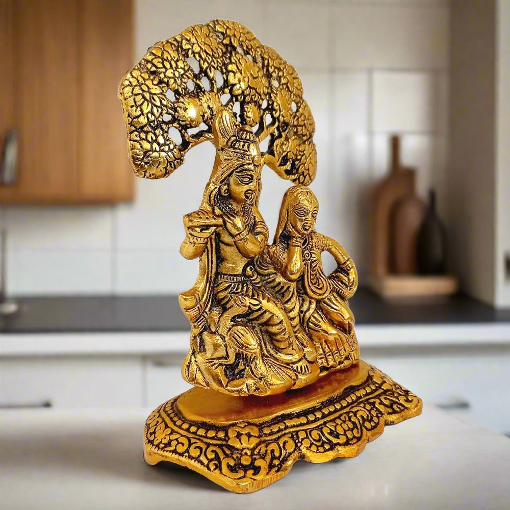 Metal Radha Krishna idol depicting love and devotion, finished in golden oxidised polish