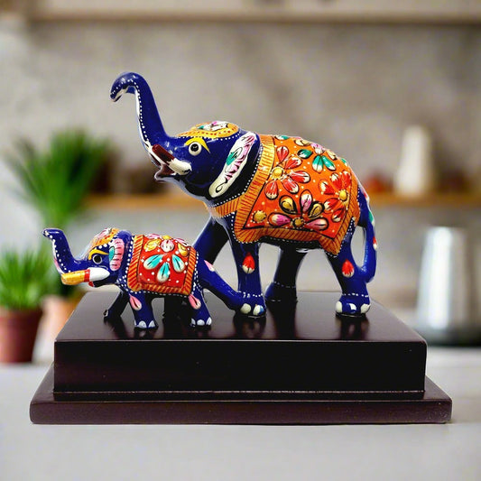 Hand-painted metal Meena elephant with baby on wooden base, home decor showpiece.