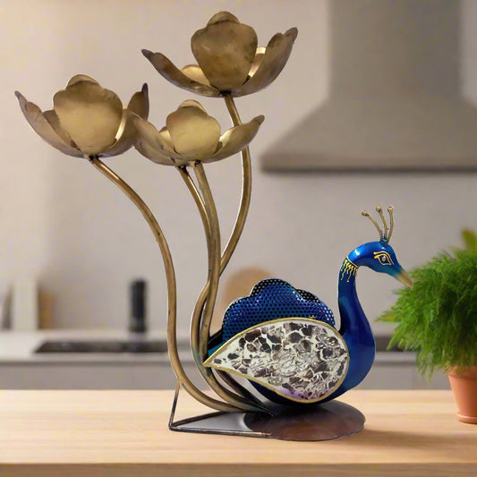 Metal peacock showpiece and candle holder with hand painting, decorated feathers with glass pieces, featuring four lotus-shaped candle stands.
