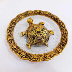Metal and glass Vastu tortoise with carved border around glass bowl, symbolizing positivity