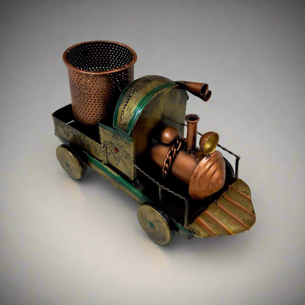 Metal pen holder designed as vintage train with handmade painting, combining functionality and beauty.