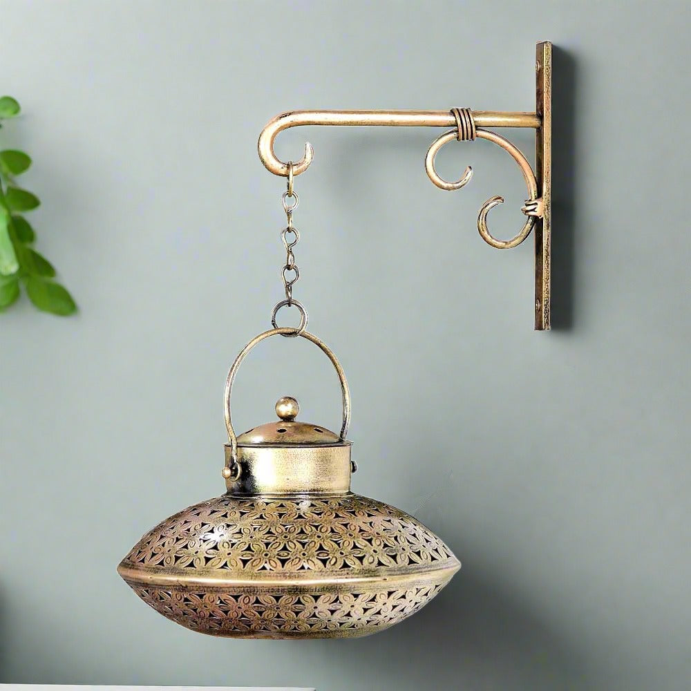 A beautiful metal wall hanging tealight candle holder with a unique dekchi (pot) design.