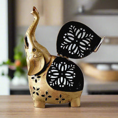 A modern elephant t-light stand with a net design on its body, perfect for home decor.