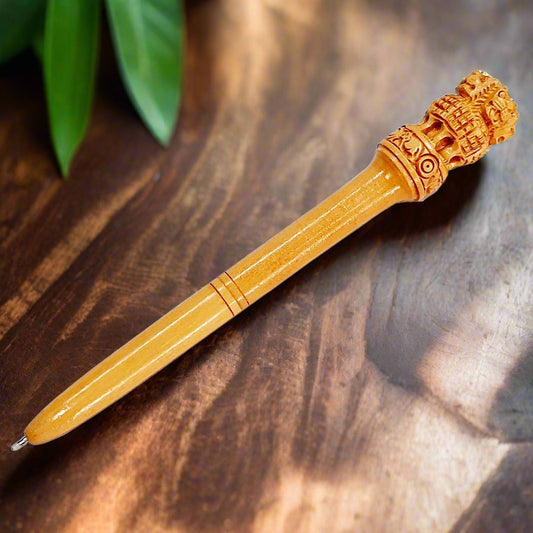 Handmade wooden pen featuring the Ashoka symbol on the top, comes with blue refill, ideal as a memorable gift.