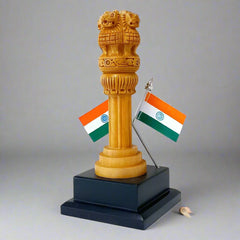 Wooden Ashoka Pillar national emblem with hand-painted details and dual Indian flags display
