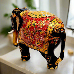 Painted wooden elephant featuring floral emboss design in gold over red background, perfect decorative and gift item