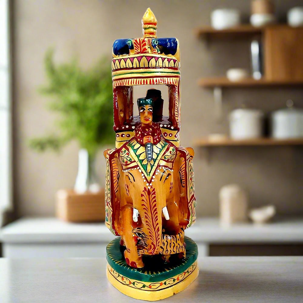Painted wooden elephant showpiece with a king (maharaja) riding on a pavilion.