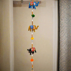 Five papier-mâché elephants toran with golden bell, beads, and threads for festive doorway decor