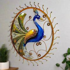 Wall mounted metal peacock frame featuring vibrant hand painting and feather decorations with elegant glass pieces.