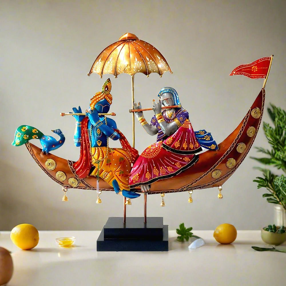 A beautiful Radha Krishna showpiece with a boat, made of metal and wood, for home decor.