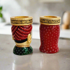 A traditional Rajasthani art figurine that doubles as a pen holder and a beautiful table top showpiece.