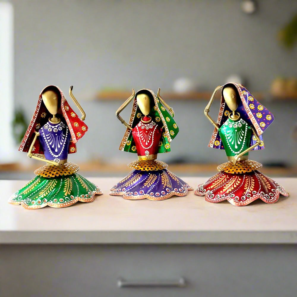 A set of 3 Rajasthani Kalbelia dance metal dolls, hand-painted with beautiful folklore details.