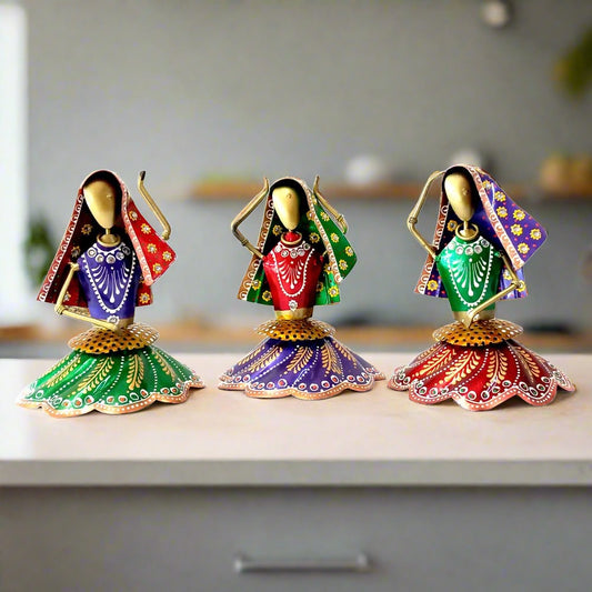A set of 3 Rajasthani Kalbelia dance metal dolls, hand-painted with beautiful folklore details.