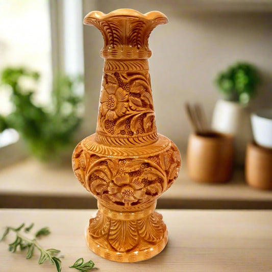 Round Kadamba wood flower pot with intricate hand-carved floral design.